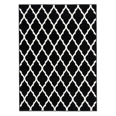 A rectangular area rug with a bold black and white trellis pattern, shown flat against a plain white background.
