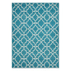 A rectangular area rug featuring a repeating geometric trellis pattern in teal blue and off-white, shown flat against a plain white background.