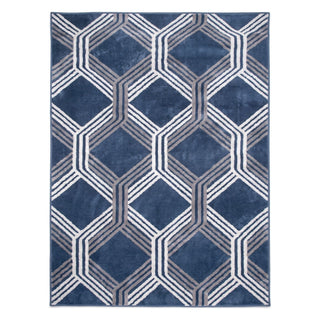 A rectangular area rug with a geometric pattern of interlocking hexagons in shades of navy blue, gray, and white, shown flat against a white background.