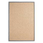A rectangular natural jute rug with a solid gray border, shown flat against a white background.