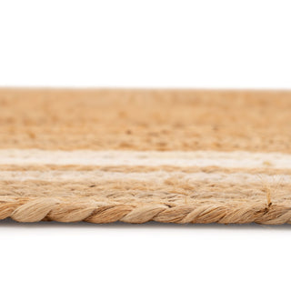 Close-up of a woven mat with natural fibers on a white background