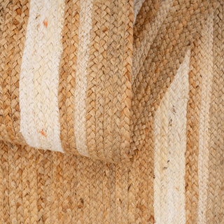 Close-up of woven jute fabric with natural beige and brown colors.