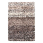 A rectangular shag area rug with horizontal stripes in shades of taupe, beige, brown, and charcoal gray, shown flat against a white background.