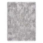 A rectangular shag area rug in a light gray color, shown from a top-down view against a plain white background.