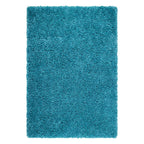 A rectangular turquoise blue shag rug with a thick, high-pile texture, shown flat against a solid white background.