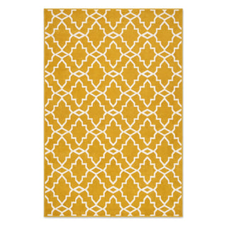 A rectangular area rug with a mustard yellow background and a white geometric trellis pattern, shown flat against a white background.