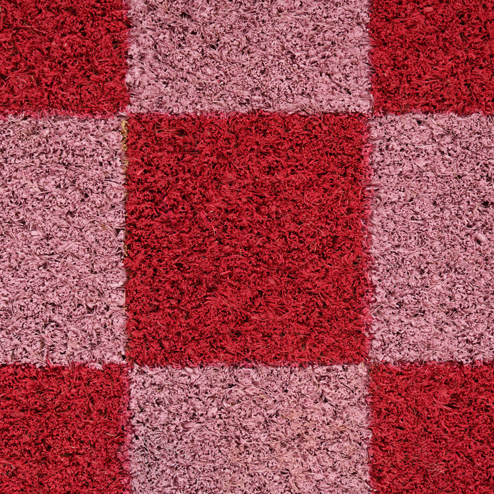 Checkered pattern of red and pink squares