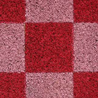 Checkered pattern of red and pink squares