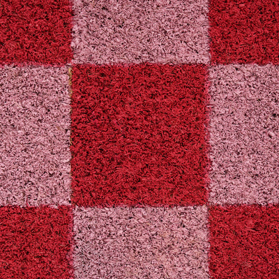 Checkered pattern of red and pink squares