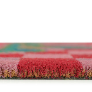 Close-up of a colorful doormat with a checkered pattern on a white background