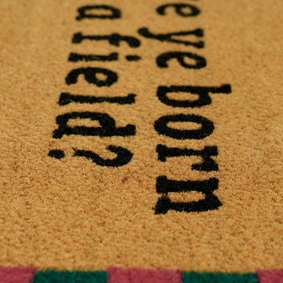 Doormat with text 'Have you ever been born?' on a textured surface.