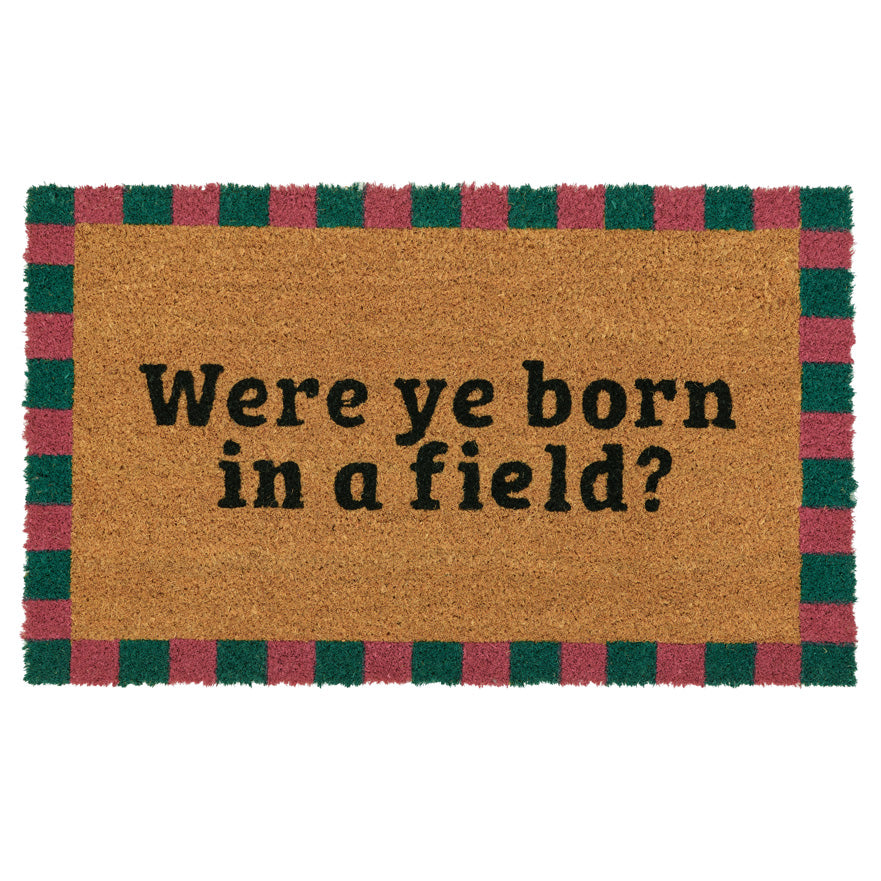 Doormat with text 'Were ye born in a field?' on a white background