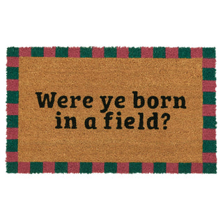 Doormat with text 'Were ye born in a field?' on a white background