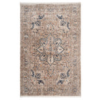 A rectangular Blue Terra Medallion Area Rug with a central floral medallion design and folded patterns in a mix of blue and earthy tones.