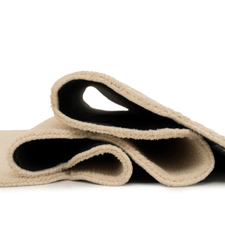 Rolled-up beige carpet on a white background