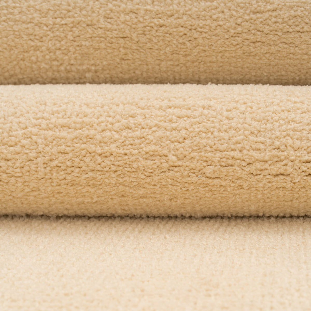 Close-up of beige and brown textured fabric swatches
