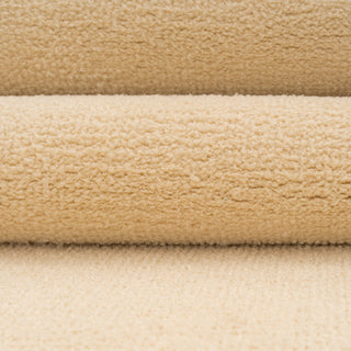 Close-up of beige and brown textured fabric swatches
