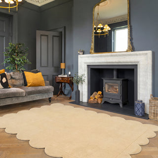 Living room with gray sofa, fireplace, and decorative elements.