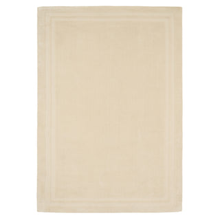 Beige bath mat on a white background