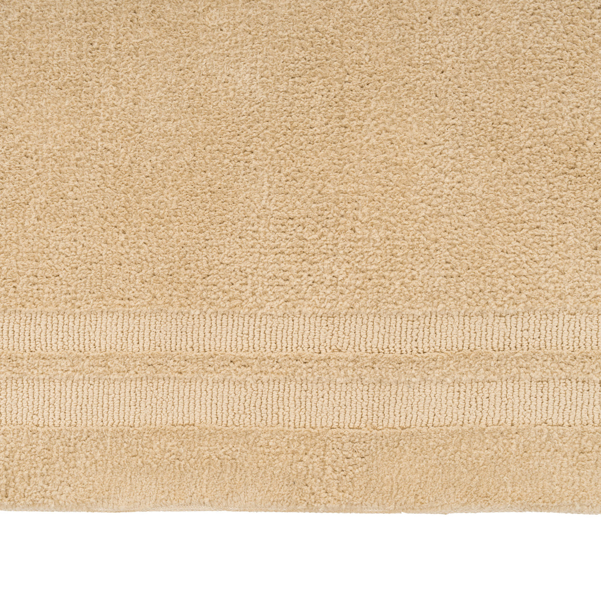 Close-up of a beige towel with a textured surface