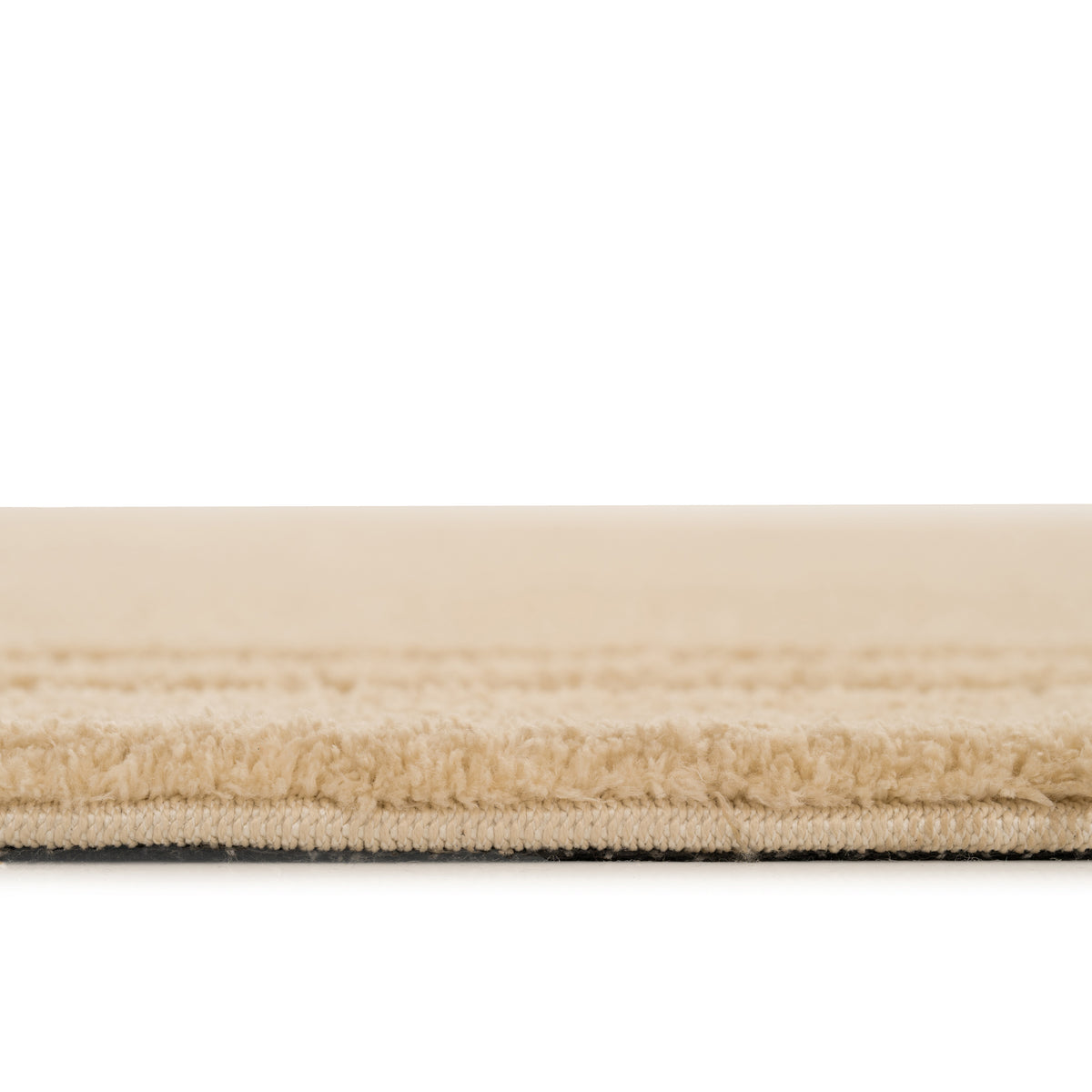 Close-up of a beige carpet with a white background