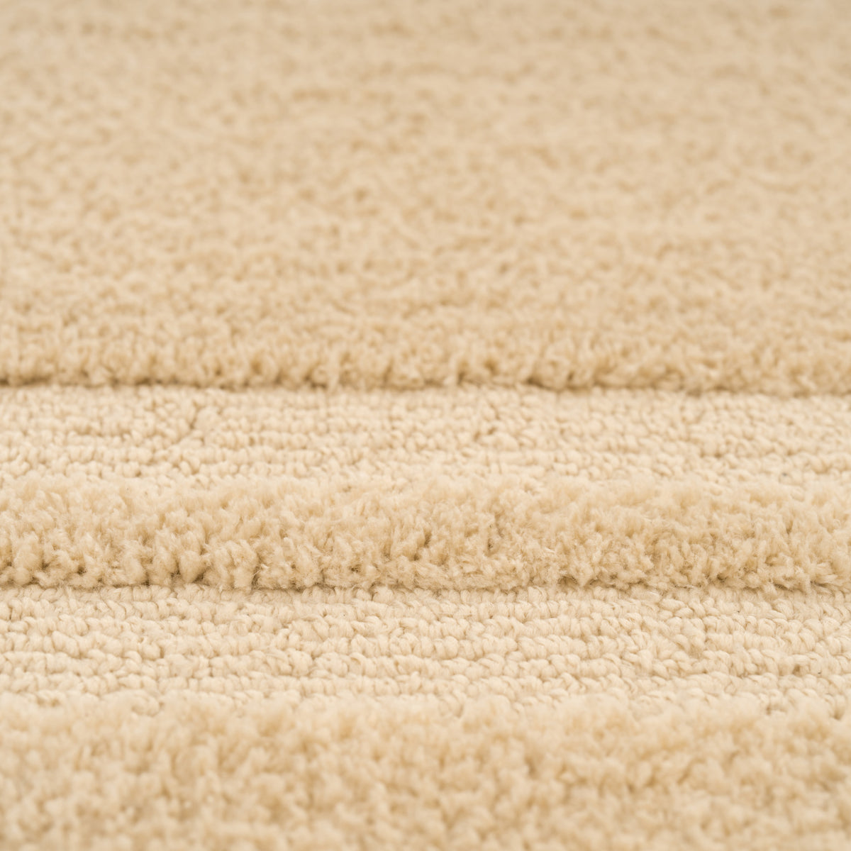 Close-up of beige carpet texture