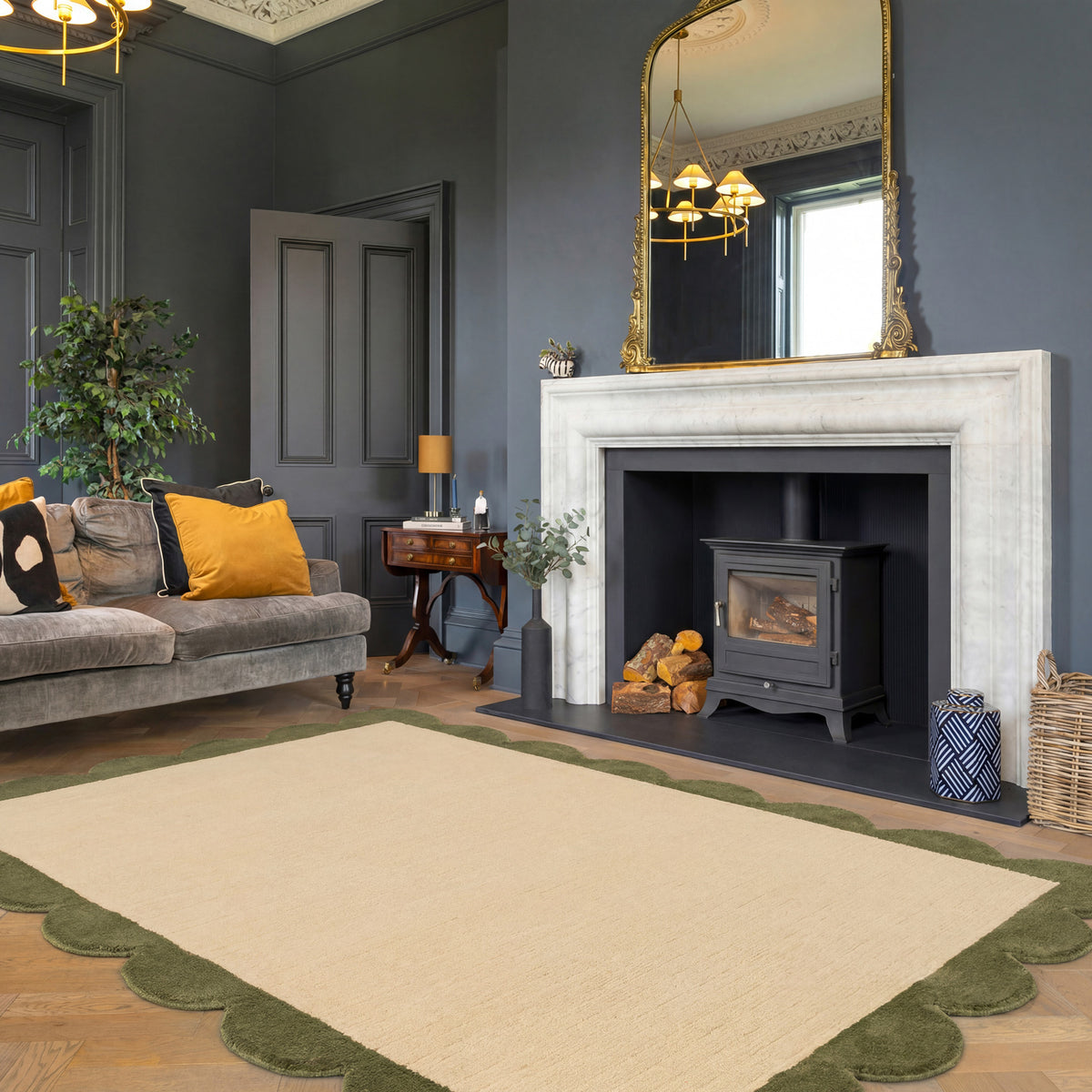 Living room with gray sofa, fireplace, and decorative elements.