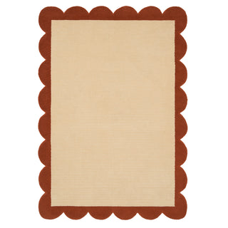 Rectangular rug with scalloped brown border on beige background