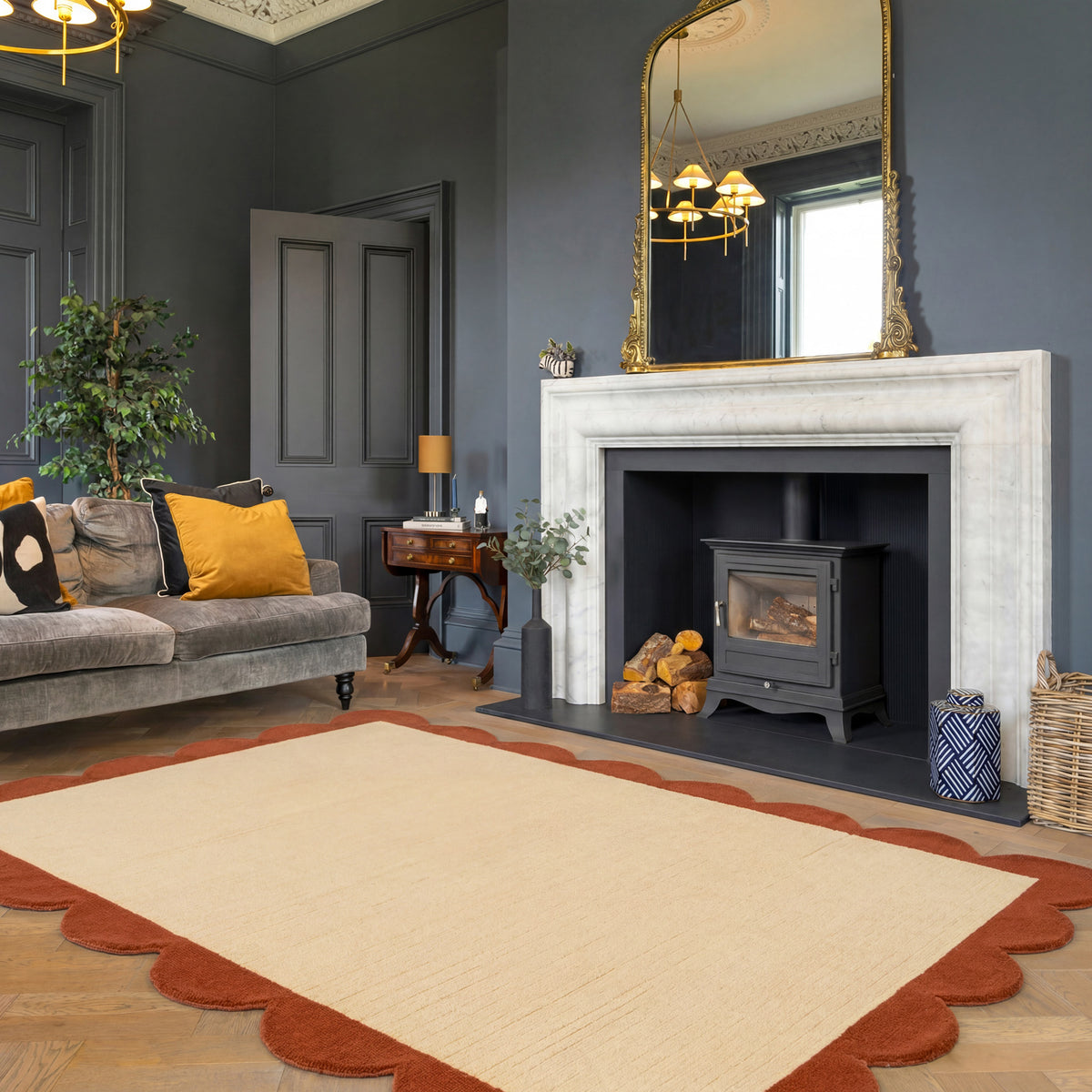 Living room with gray sofa, fireplace, and decorative elements.