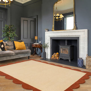 Living room with gray sofa, fireplace, and decorative elements.