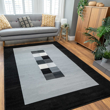 Geometric Bordered Black and Grey Rug