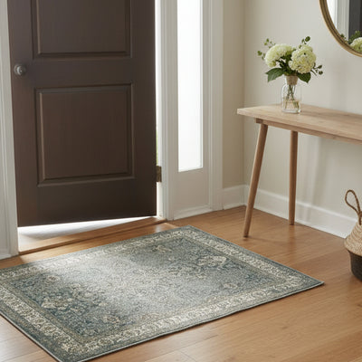 Decorative area rug with intricate patterns and a border on a plain background