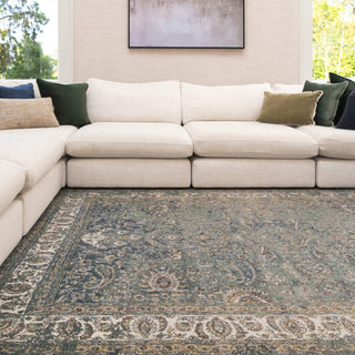 Living room with a white sectional sofa and patterned rug